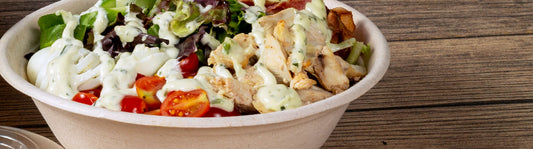 salad in a 32 oz tan molded fiber bowl