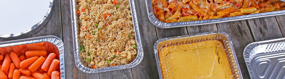 various aluminum pans with food in them for a buffet