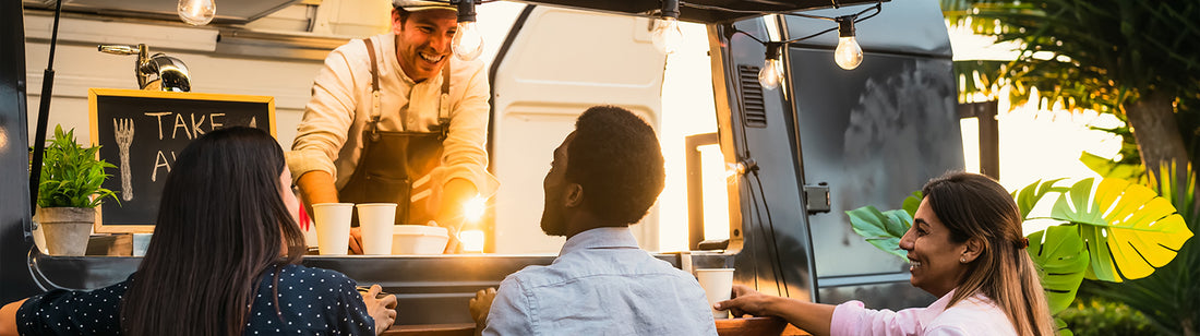 three customers at a food truck window