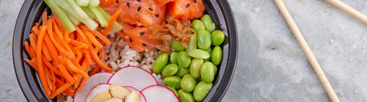 sushi bowl in a round black take-out container