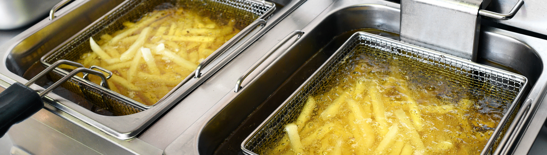 Fries deep frying in freshly filtered oil