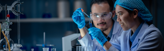 scientist wearing disposable gloves and doing an experiment