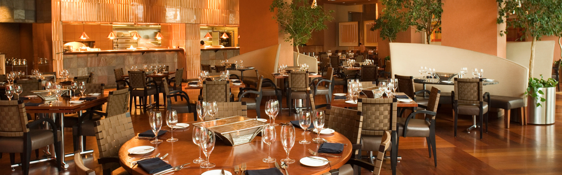 Stylish restaurant with tables set and ready for the day