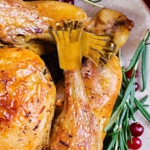 turkey with shiny gold chop holders on the legs