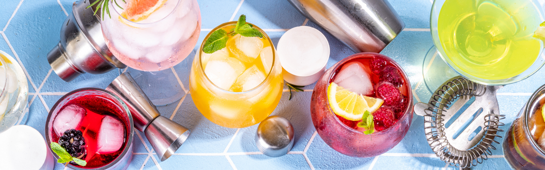 colorful drinks with a variety of garnishes