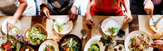 table full of patrons at a busy restaurant
