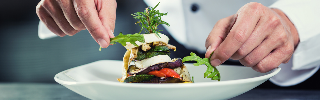 chef garnishing a dish