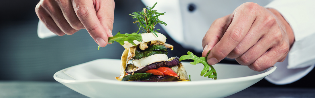 chef garnishing a plate