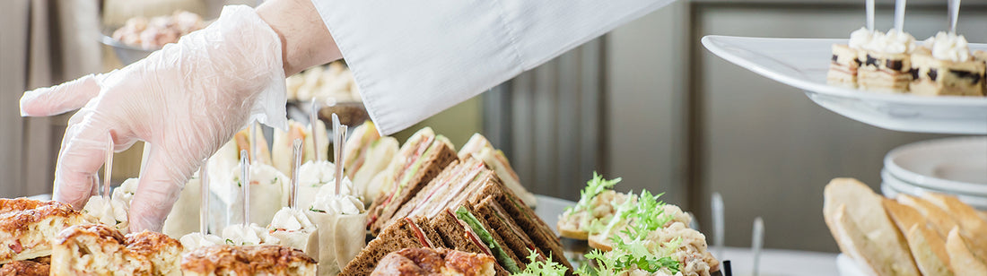 caterer setting out hors d'oeuvres 