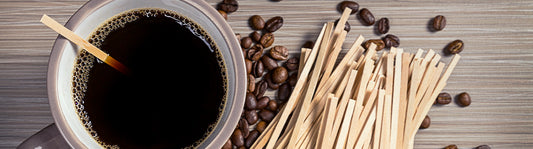 mug of coffee with a bamboo stirrer in it