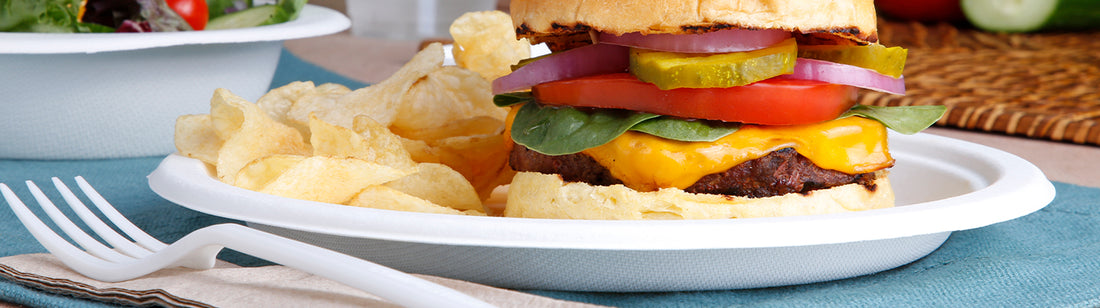 burger and chips on a molded fiber plate