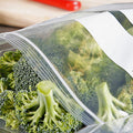 fresh cut broccoli in a clear plastic zip bag