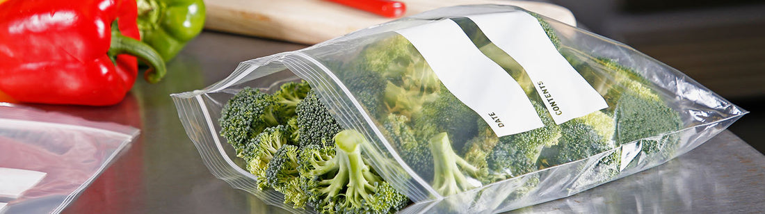 fresh cut broccoli in a clear plastic zip bag