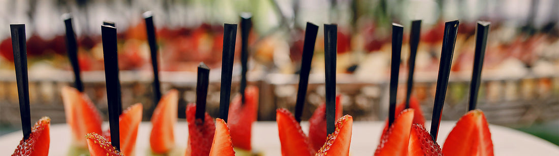 appetizers prepped with black prism picks in them