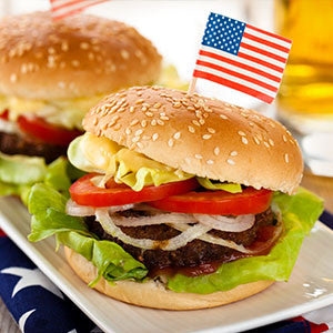 two burgers with flag picks