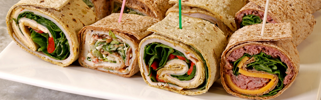 rolled wrap appetizers with food picks in them