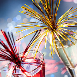 cocktails with decorative firework foil straws in them
