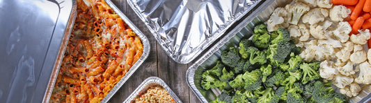 catering food boxes, one with food one with aluminum pans inside