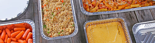 foil baking pans with food inside