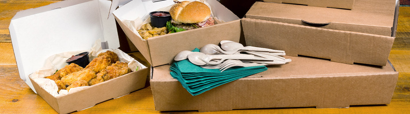 catering food boxes, 2 closed and 2 open with food inside