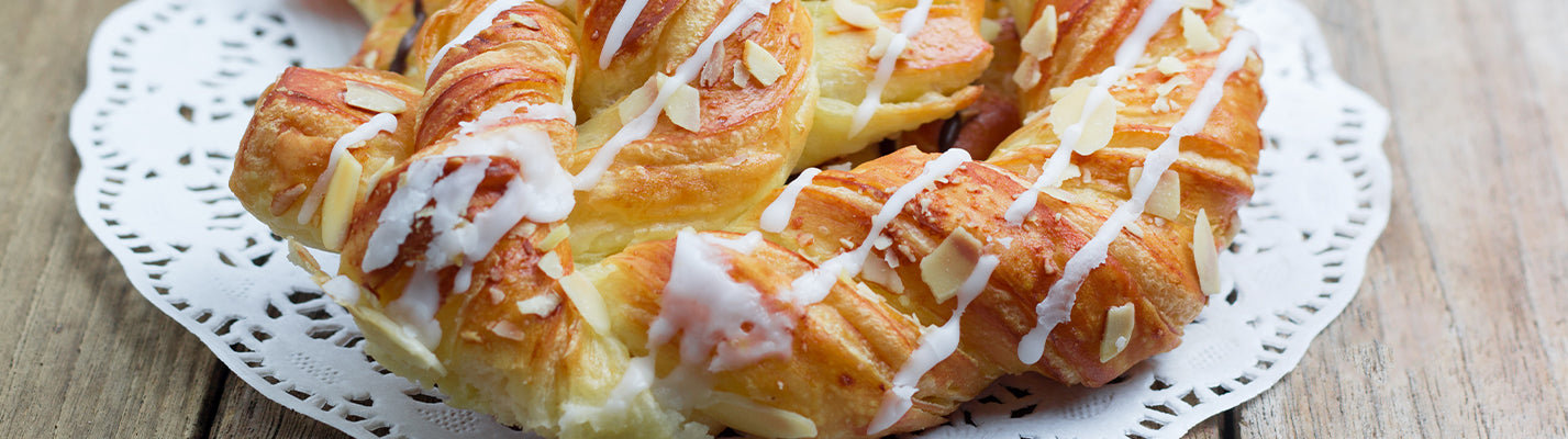 lovely white doilie with an iced strudel on top