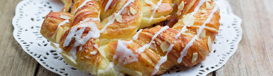 lovely white doilie with an iced strudel on top