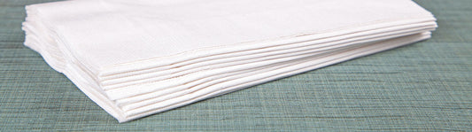 small stack of white folded napkins