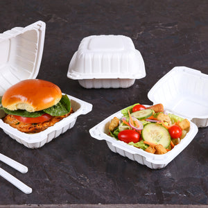 takeout in mineral filled containers with white cutlery on the side