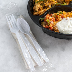 Mexican takeout with a white cutlery kit on the side