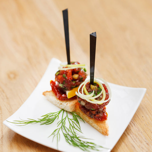 4" Black Prism Picks Inserted in Appetizers