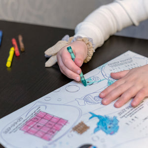 image of a child coloring using 6 color bulk crayons