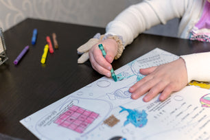 image of a child coloring using 6 color bulk crayons