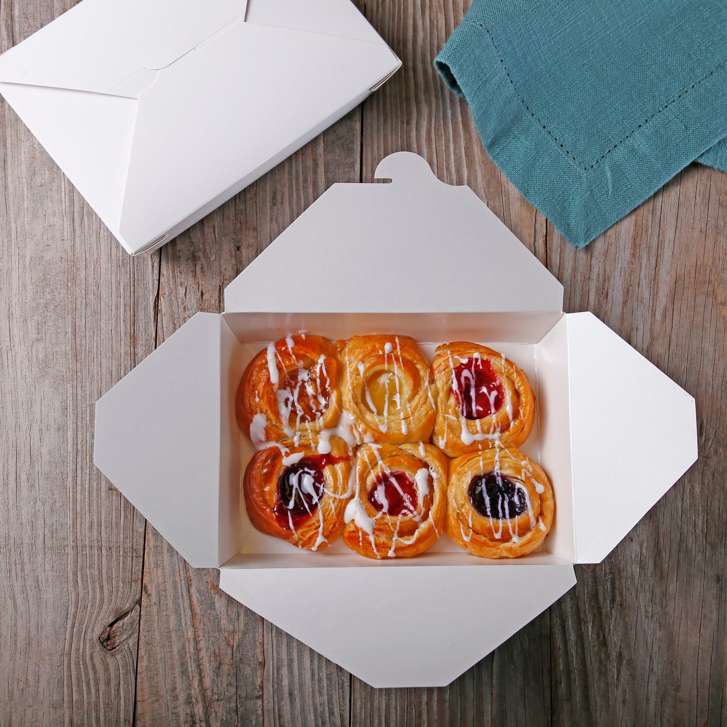 pastries in a 7-3/4" x 5.5" x 1-7/8" #2 White Folded Takeout Box