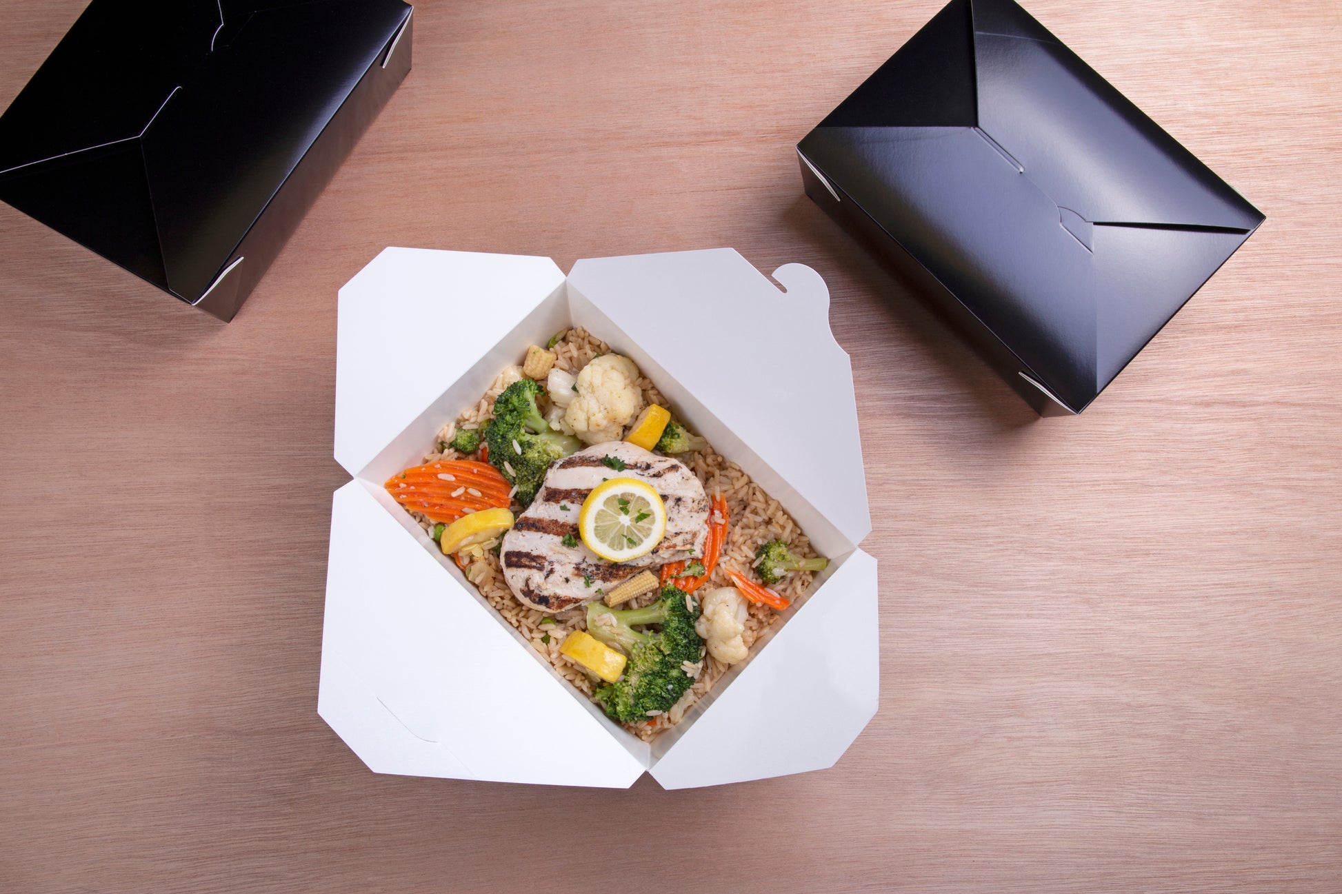 Rice, chicken and veggies in a 7-3/4" x 5.5" x 2.5" #3 Black Folded Takeout Box