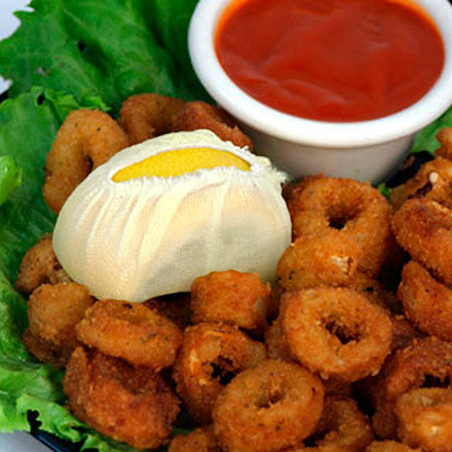 Lemon in White Wedge Bag on Plate of Onion Rings