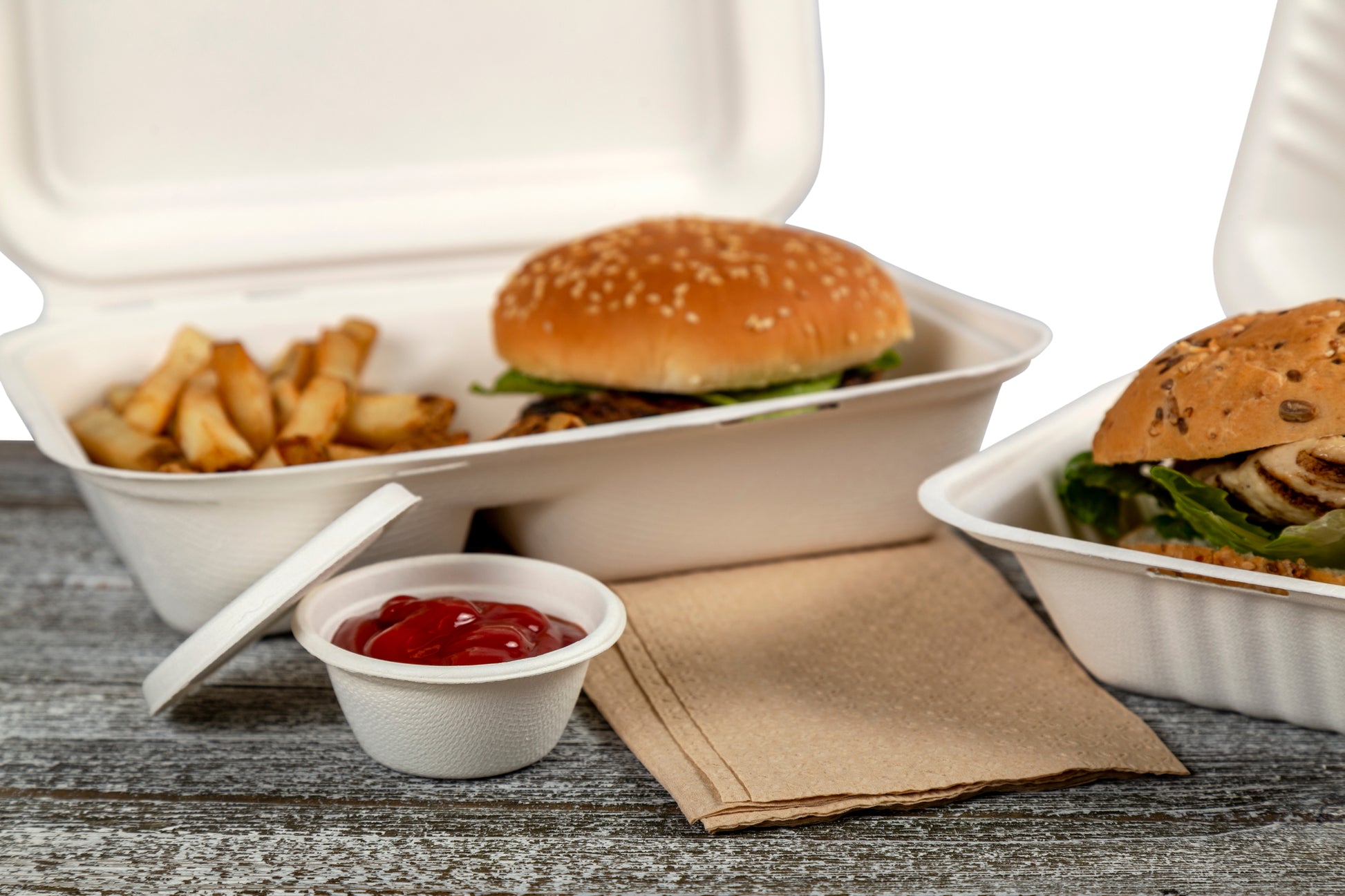 takeout order with a 2 oz molded fiber portion cup of sauce beside them