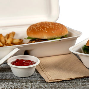 takeout order with a 2 oz molded fiber portion cup of sauce beside them