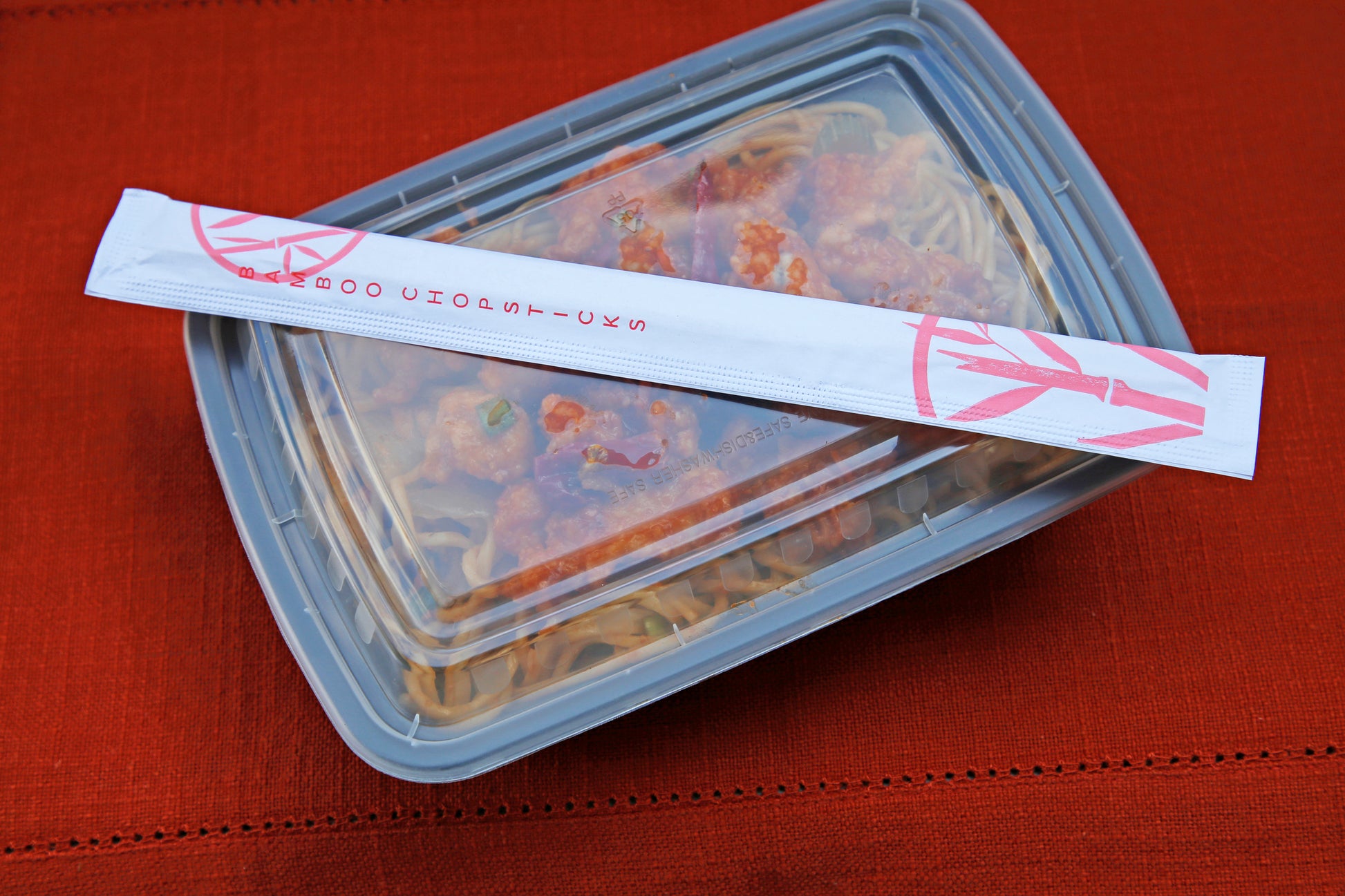 Takeout with Twin Bamboo Chopsticks in a Closed Sleeve on top