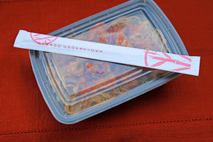 Takeout with Twin Bamboo Chopsticks in a Closed Sleeve on top