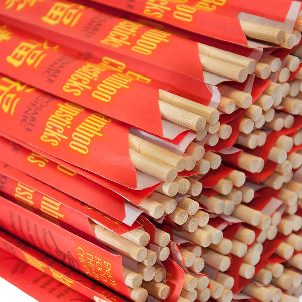 Close-up of Disposable Bamboo Chopsticks in Red Sleeves