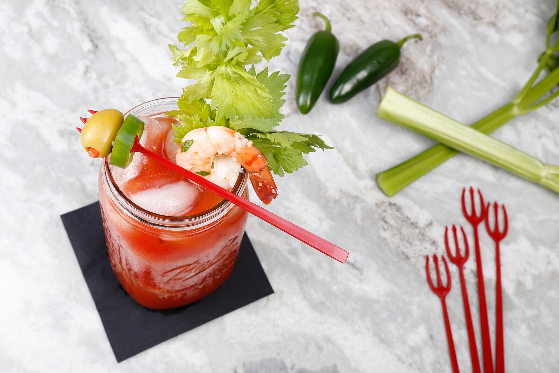 drink with a garnish on a Plastic 3 Prong Red Devil Forks