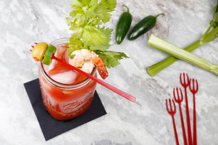 drink with a garnish on a Plastic 3 Prong Red Devil Forks