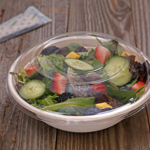PET Lid for 32 oz. Tan Bowl on the bowl with salad inside