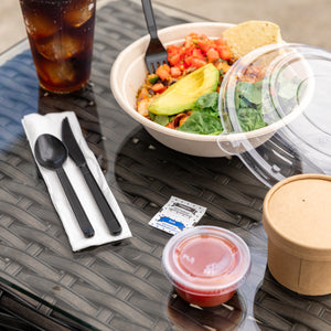 Rice and veggies in a 32 oz tan bowl with the matching clear PET lid to the side