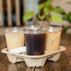 Cold drinks in four 16 oz clear PET cups with matching lids