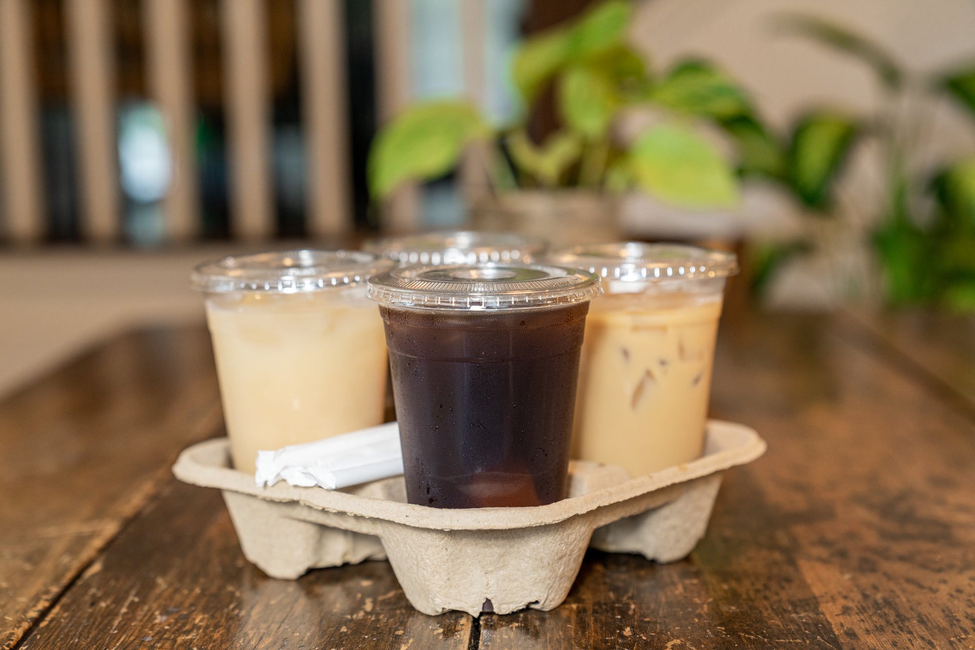 Cold drinks in four 16 oz clear PET cups with matching lids