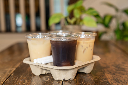 Cold drinks in four 16 oz clear PET cups with matching lids