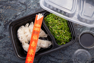 Dumplings and Nori in a 2 Compartment Black 32oz Rectangular Container