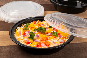 48 oz round microwavable takeout container with nacho dip inside and matching clear lid to the side