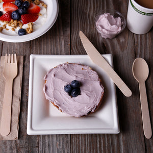 Disposable Wooden Knife at a breakfast table with other compostable disposables